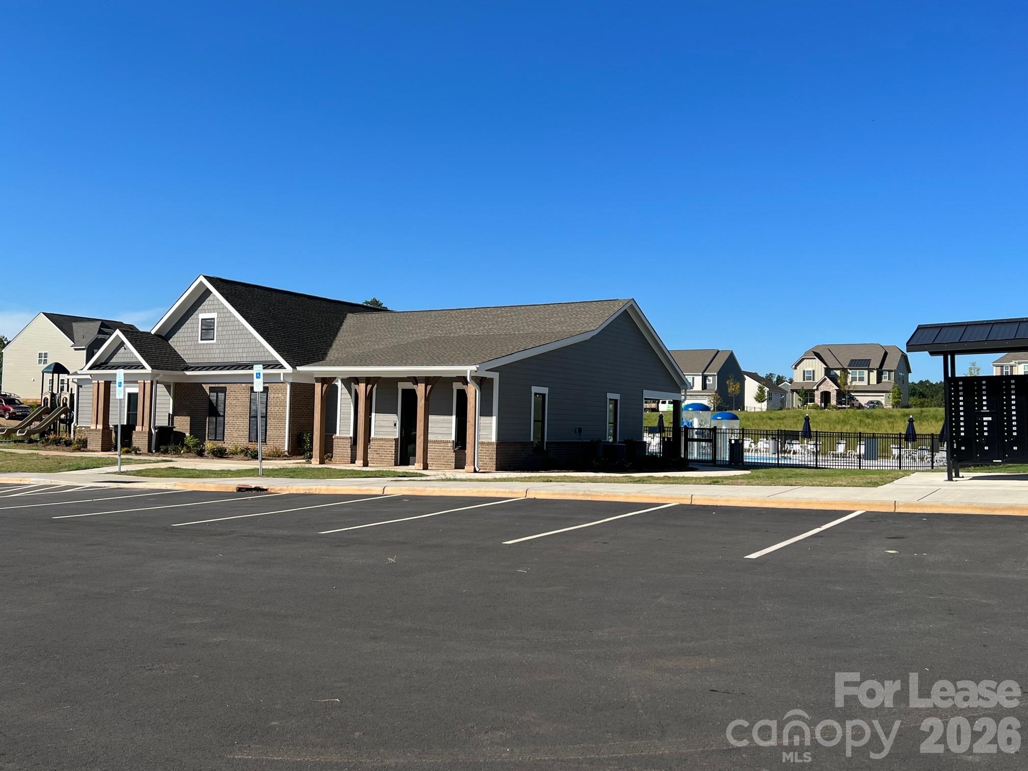 202 Tackle Troutman, NC 28166 - Photo 24 of 25 a front view of a house with a yard and fountain