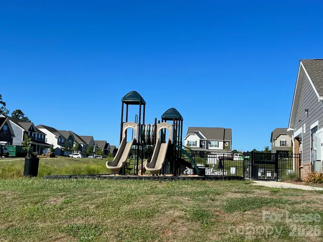 a view of a house with yard and entertaining space