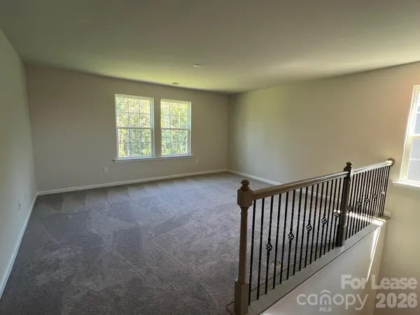 a view of a hallway with a window