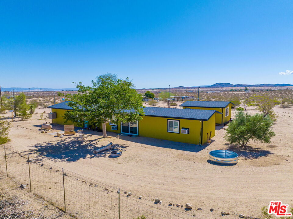 57157 Emerald Way Landers, CA 92285 - Photo 1 of 12 a view of a lake with a mountain