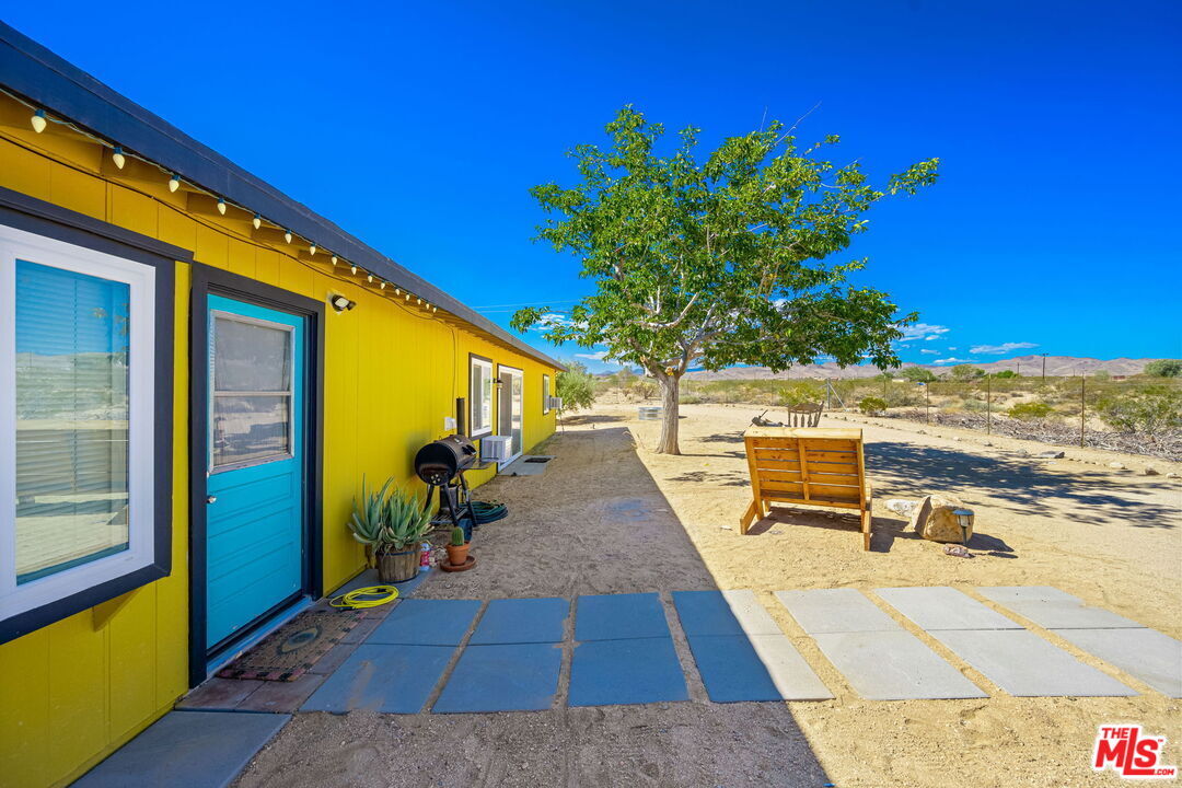 57157 Emerald Way Landers, CA 92285 - Photo 11 of 12 a view of a swimming pool with a patio