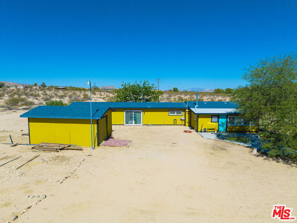 57157 Emerald Way Landers, CA 92285 - Photo 2 of 12 a view of a house with a outdoor space