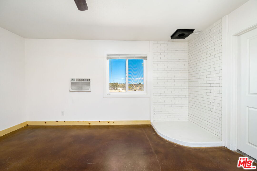 57157 Emerald Way Landers, CA 92285 - Photo 9 of 12 a view of a room that has a window