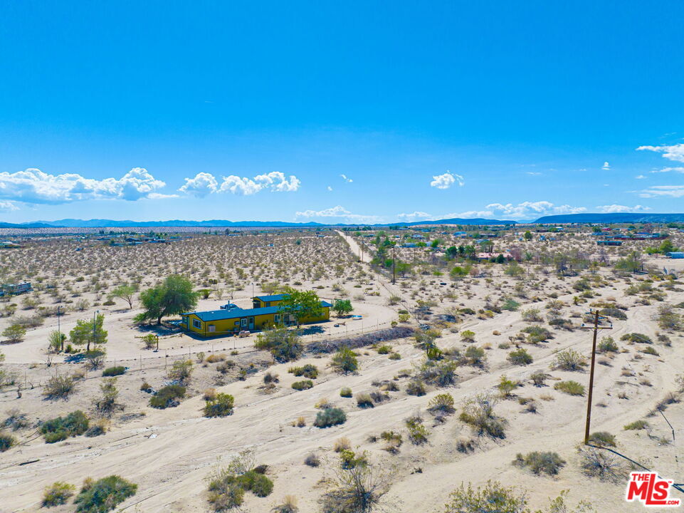 57157 Emerald Way Landers, CA 92285 - Photo 10 of 12 a view of a lake with a beach