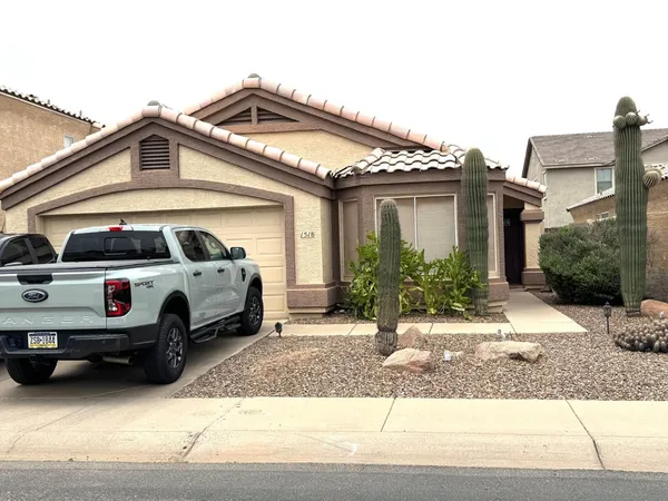 a view of a car park in front of house