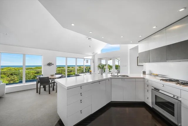 a kitchen with furniture and window