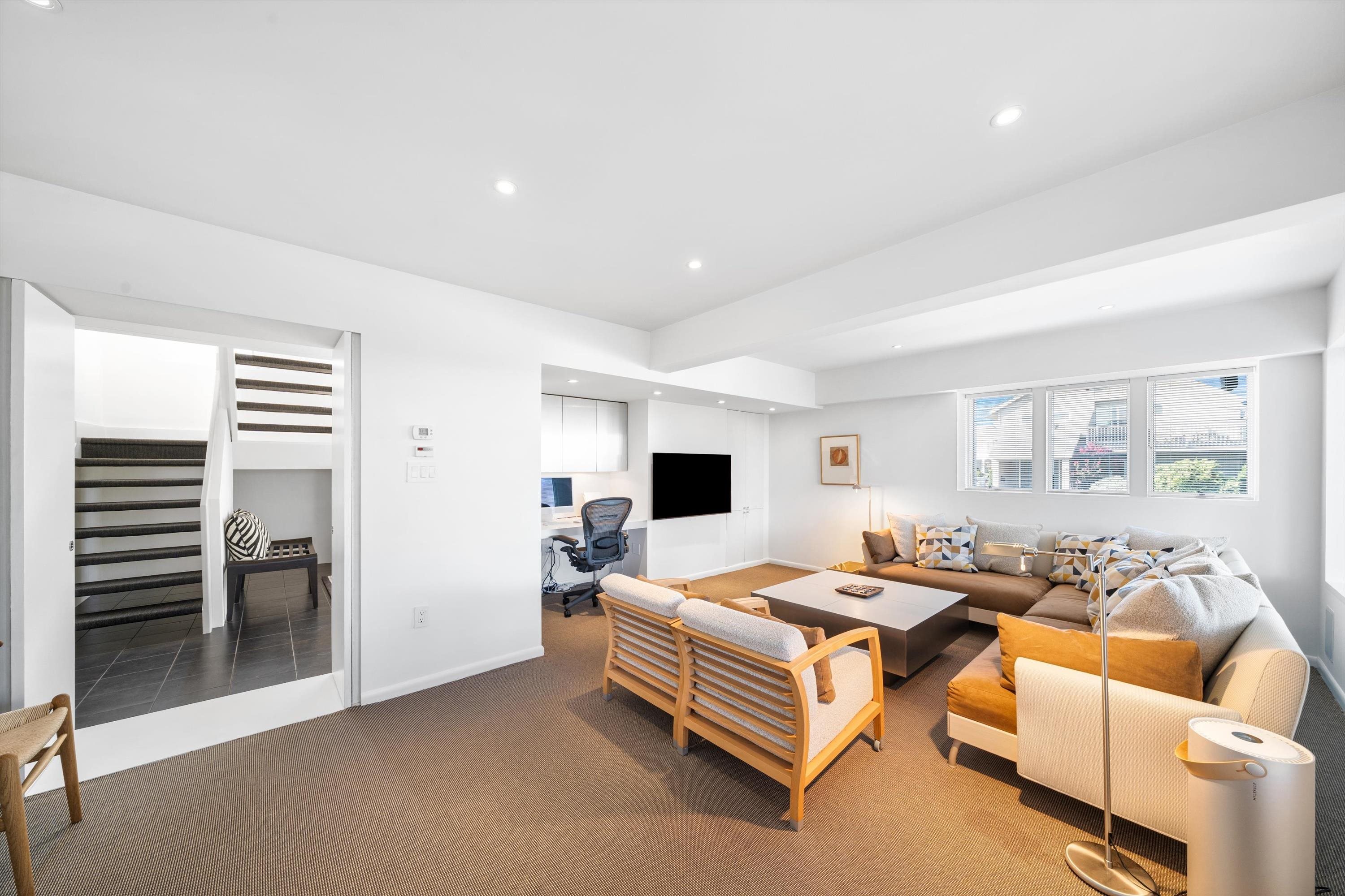 103 116th Street Stone Harbor, NJ 08247 - Photo 18 of 49 a bedroom with furniture and a flat screen tv