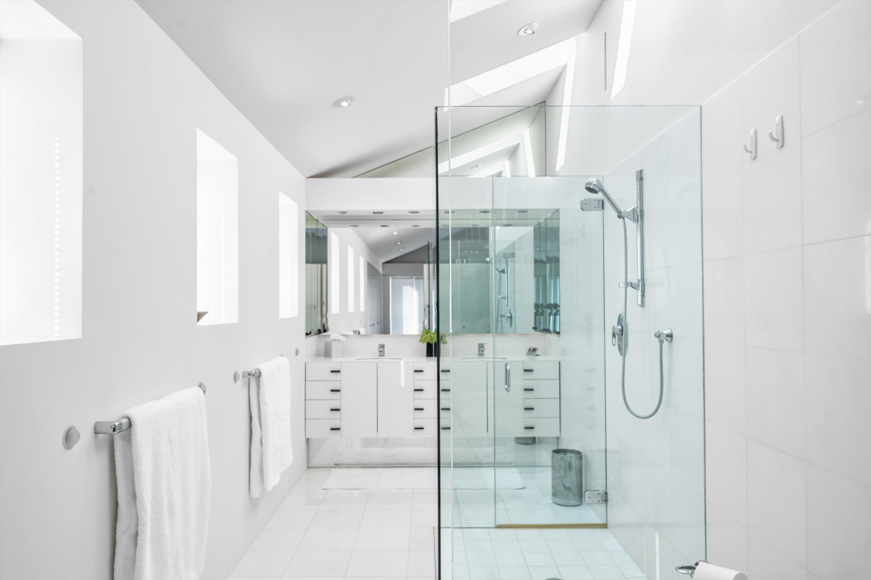 103 116th Street Stone Harbor, NJ 08247 - Photo 32 of 49 a bathroom with a glass shower door