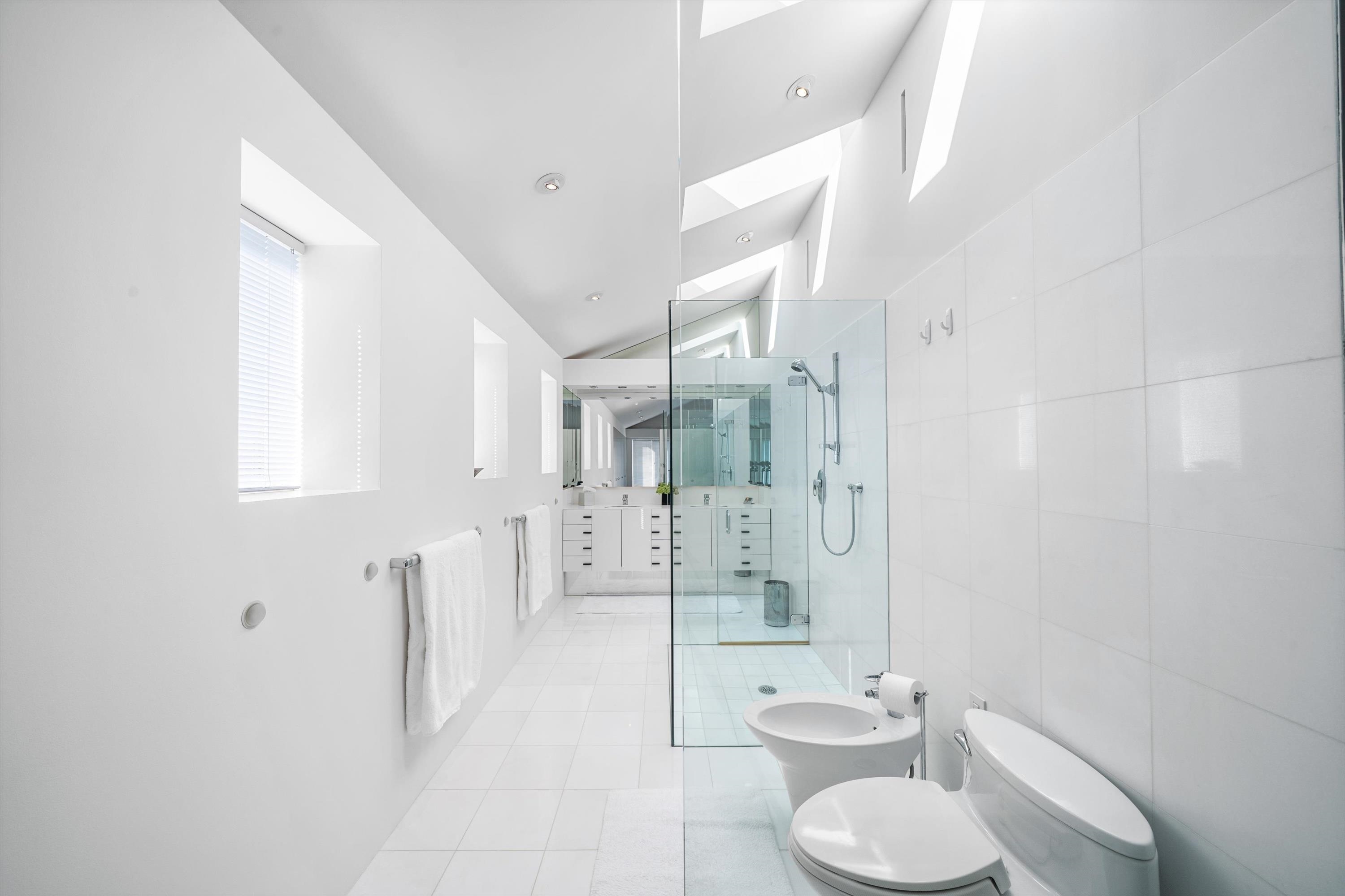 103 116th Street Stone Harbor, NJ 08247 - Photo 33 of 49 a bathroom with a toilet sink and shower