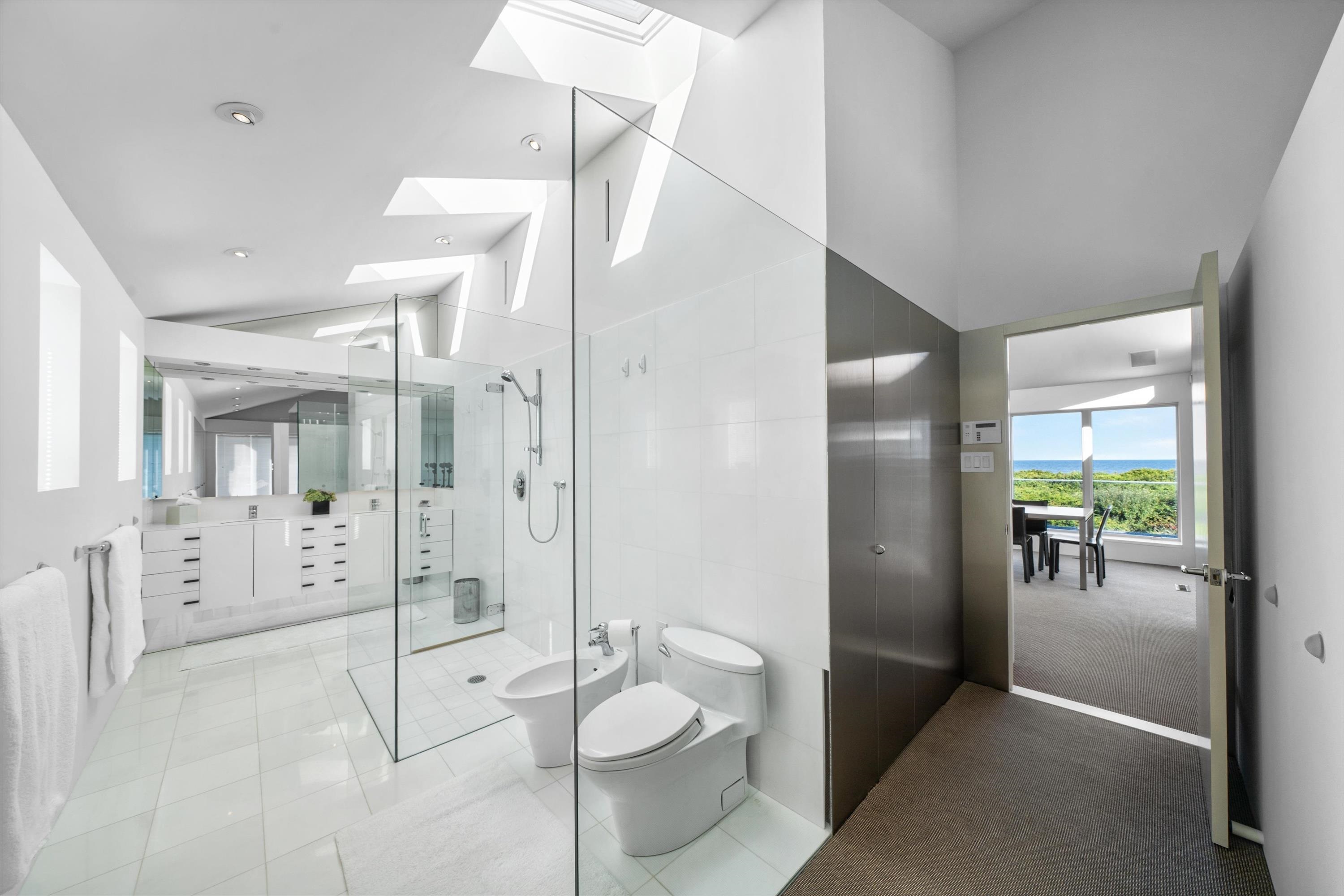 103 116th Street Stone Harbor, NJ 08247 - Photo 34 of 49 a bathroom with a shower sink and toilet