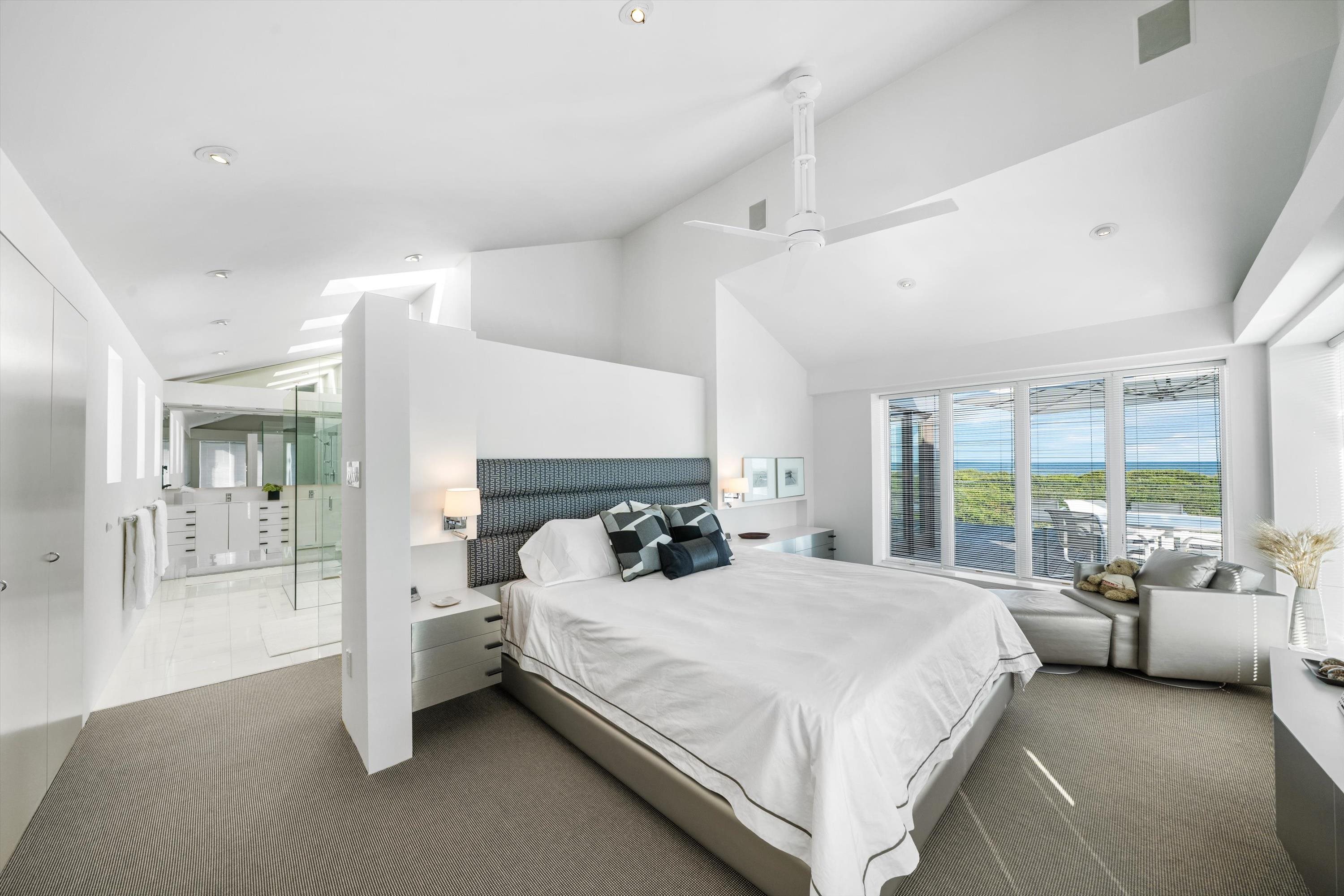 103 116th Street Stone Harbor, NJ 08247 - Photo 35 of 49 a bedroom with a bed couch and large window with outer view