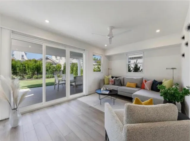 a spacious bedroom with a bed a couch and a bookshelf