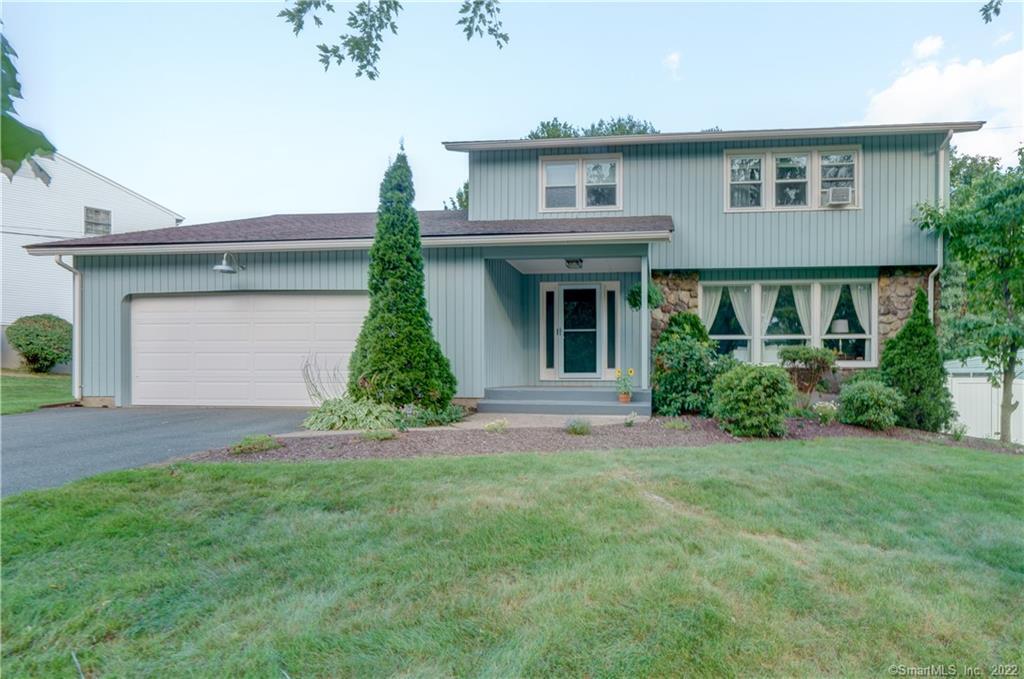 225 Kennedy Road Manchester, CT 06042 - Photo 1 of 1 a front view of a house with a yard and garage