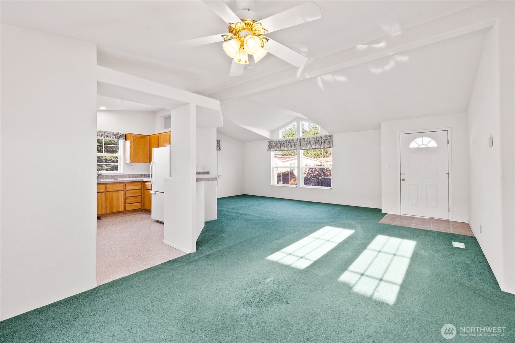 507 North 7th Avenue Sequim, WA 98382 - Photo 2 of 40 an empty room with chandelier fan and windows