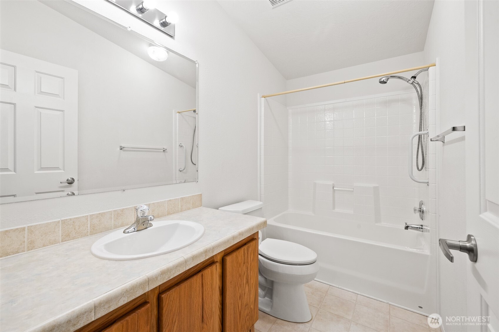507 North 7th Avenue Sequim, WA 98382 - Photo 24 of 40 a bathroom with a granite countertop sink toilet and shower