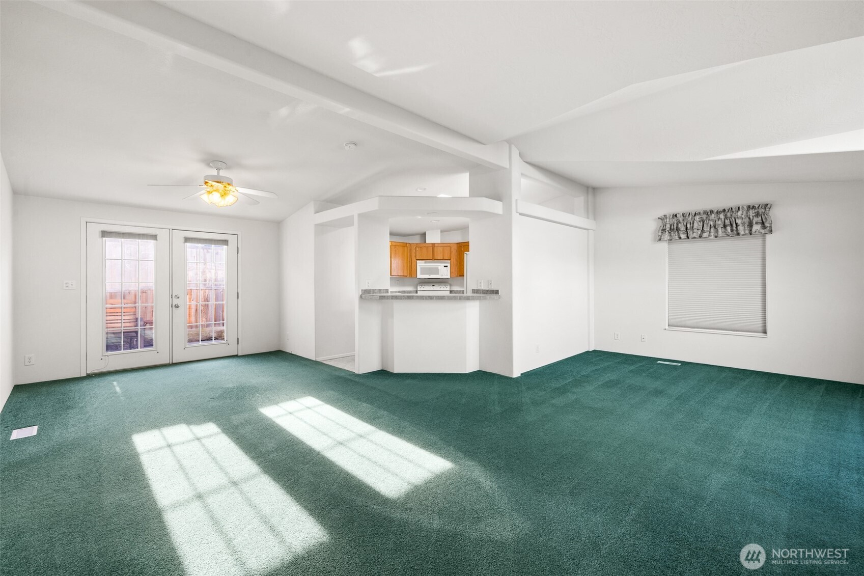 507 North 7th Avenue Sequim, WA 98382 - Photo 3 of 40 a view of an empty room with window and kitchen view