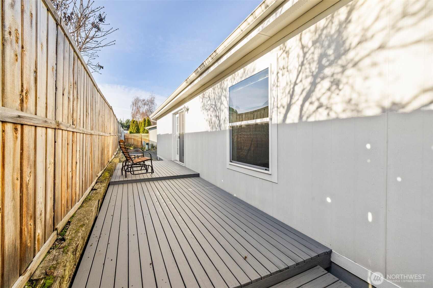 507 North 7th Avenue Sequim, WA 98382 - Photo 38 of 40 a view of balcony with wooden floor and fence and a floor to ceiling window