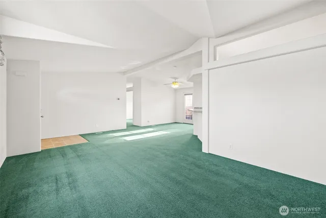 a view of an empty room with closet