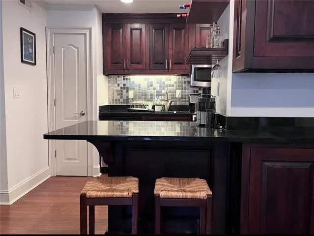 a kitchen with a sink cabinets and window