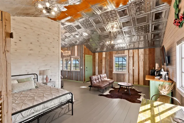 a bathroom with a sink a toilet a mirror and shower