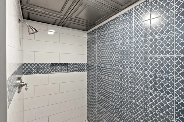 a front view of a house with a yard and mountain view