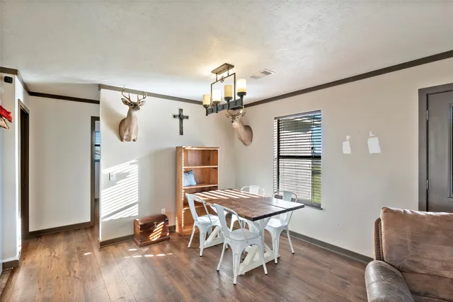 a view of a livingroom with furniture and a ceiling fan
