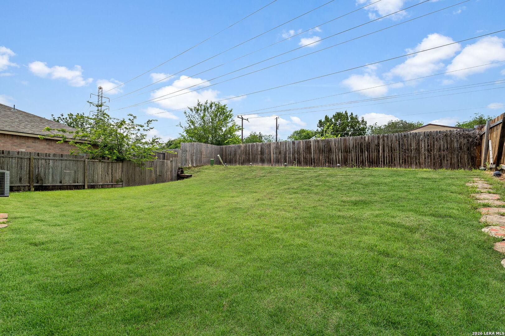 7207 Avery Road Live Oak, TX 78233 - Photo 30 of 32 a view of a yard with a fence