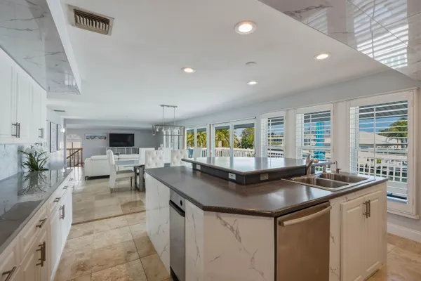 a kitchen that has a sink and cabinets