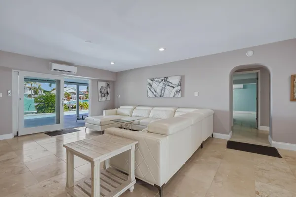 a kitchen with stainless steel appliances granite countertop white cabinets sink and a granite counter top