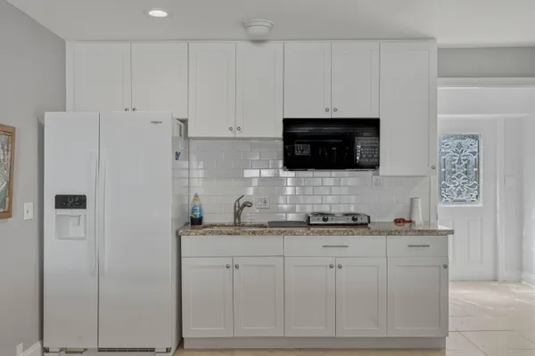 a bedroom with a bed and a cabinets