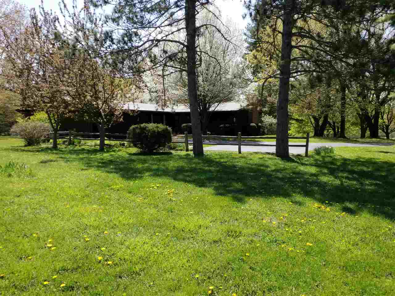 1548 Riverside Road Belvidere, IL 61008 - Photo 2 of 21 a view of a park with large trees