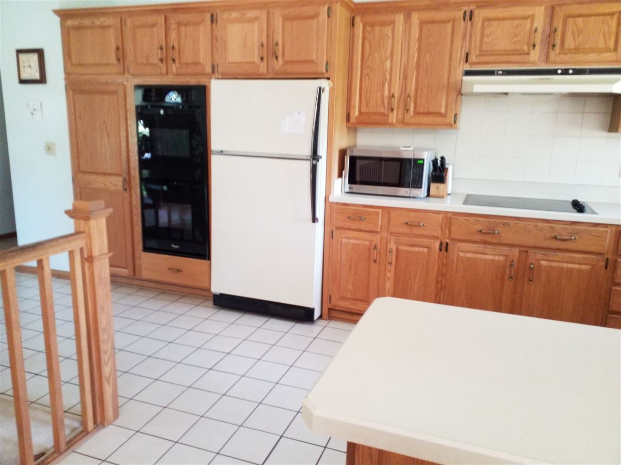 1548 Riverside Road Belvidere, IL 61008 - Photo 5 of 21 a kitchen with stainless steel appliances a refrigerator and cabinets