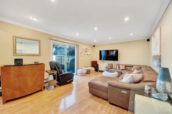 a living room with furniture window and a flat screen tv