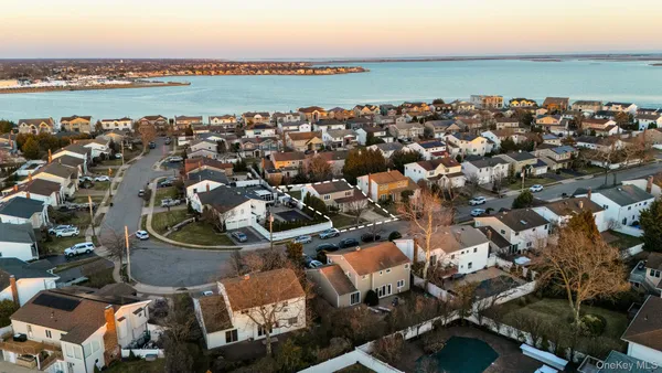 an aerial view of a house with a lake view