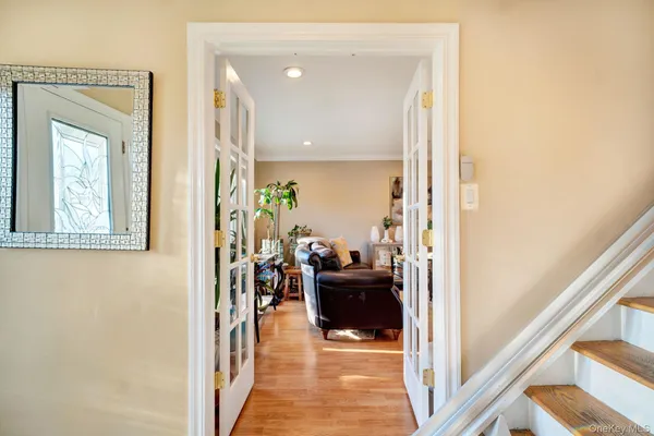 a hallway with living room and furniture