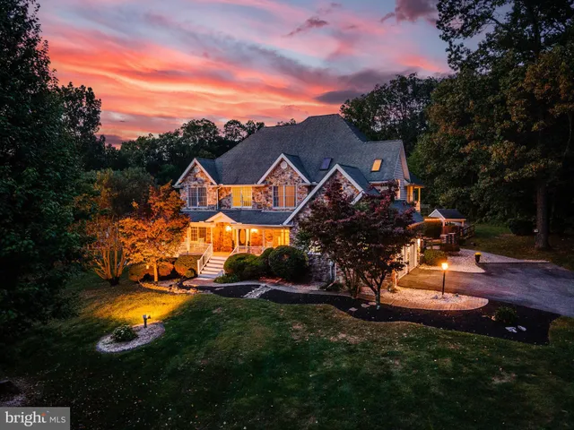 a view of a swimming pool with a patio and a yard