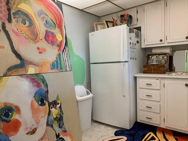 a white refrigerator freezer sitting inside of a kitchen