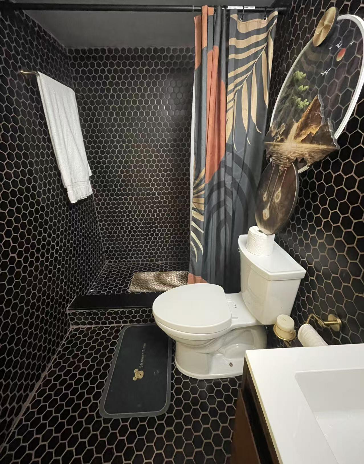 500 Executive Center Drive, Unit 3F West Palm Beach, FL 33401 - Photo 14 of 20 a white toilet sitting on top of a sink