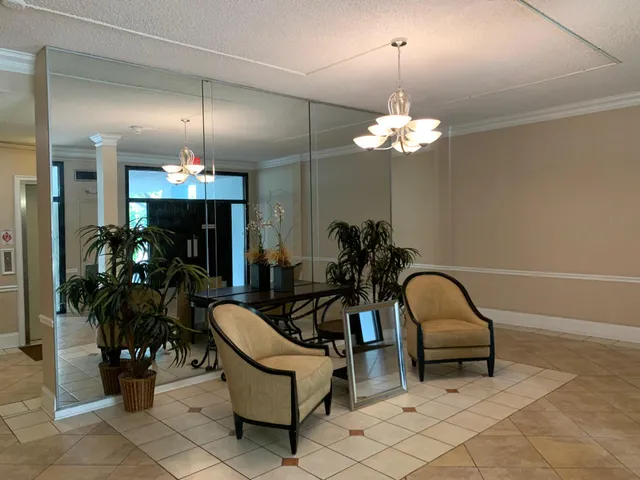 a view of a livingroom with furniture and chandelier