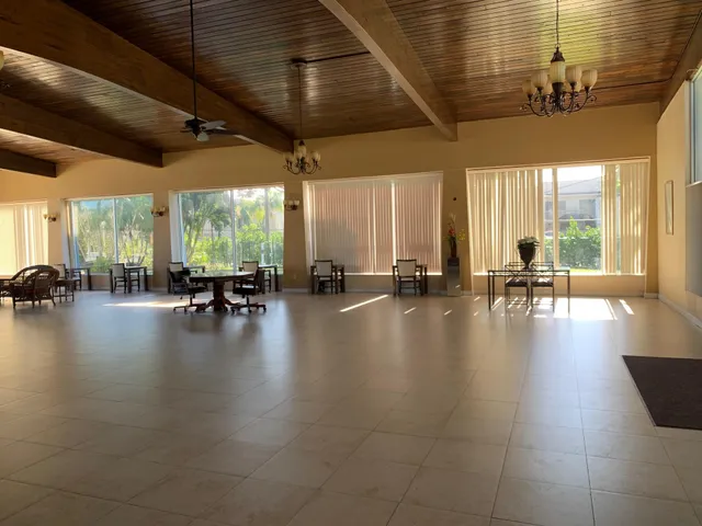 a lobby with furniture and a large window