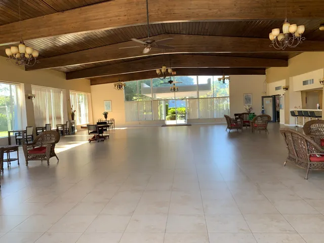 a view of a gym with lounge chair