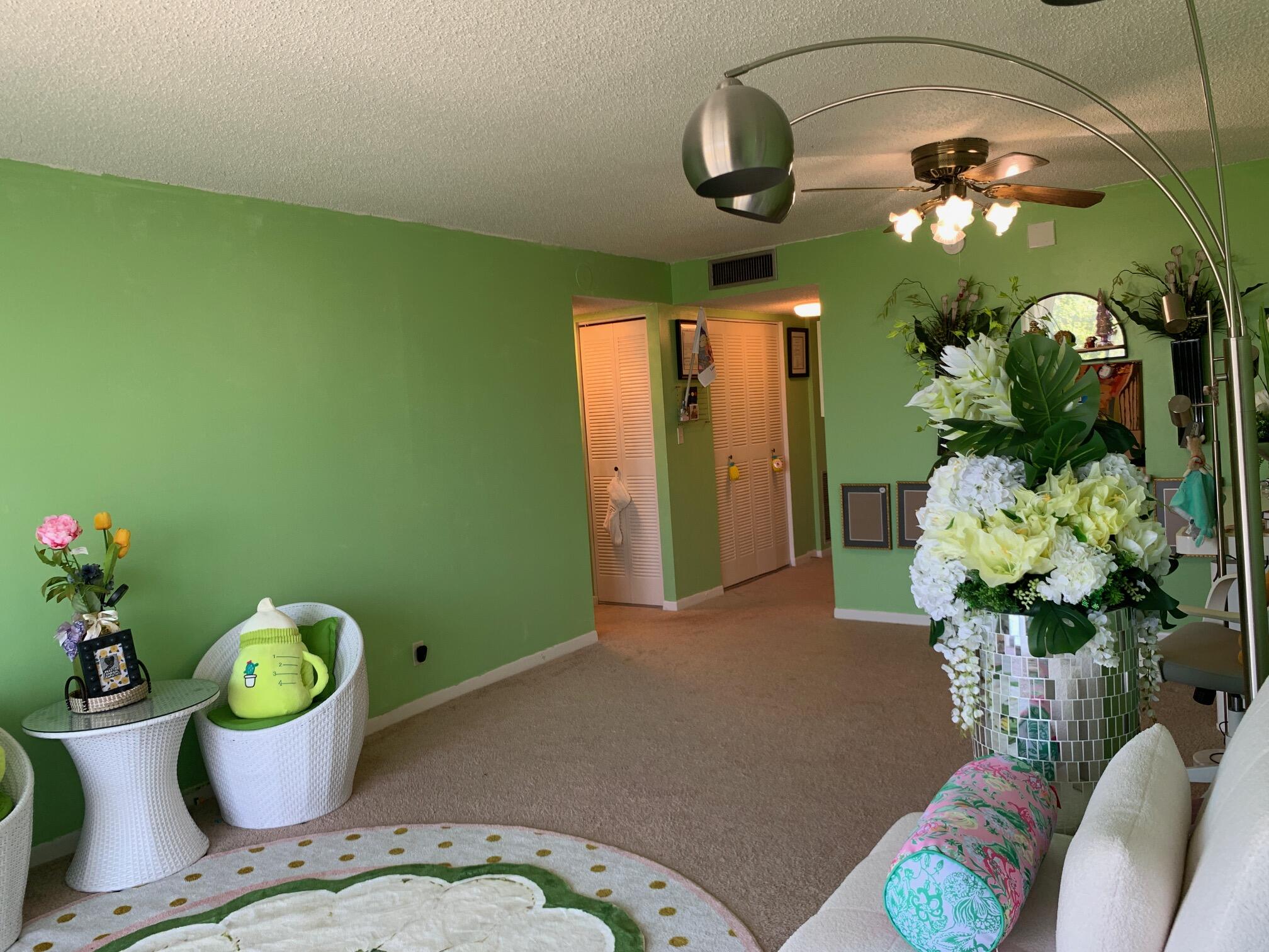 500 Executive Center Drive, Unit 3F West Palm Beach, FL 33401 - Photo 5 of 20 a dining room with furniture and potted plant