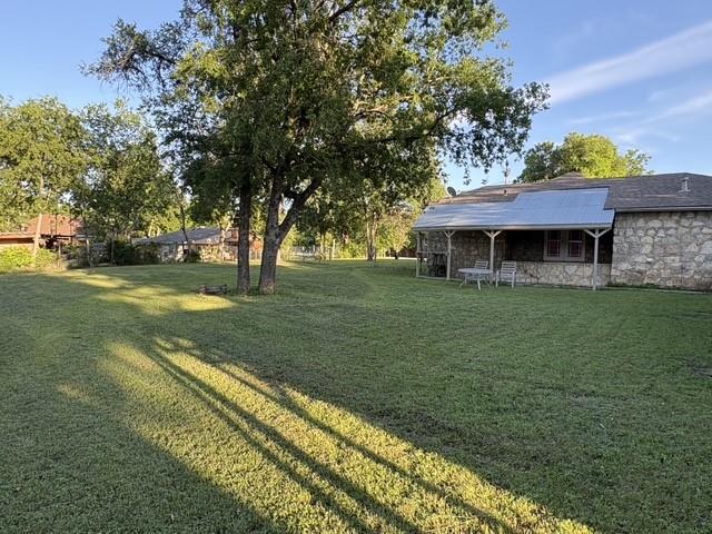 4876 East Williams Spring Road Fort Worth, TX 76135 - Photo 20 of 20 a view of a house with a yard