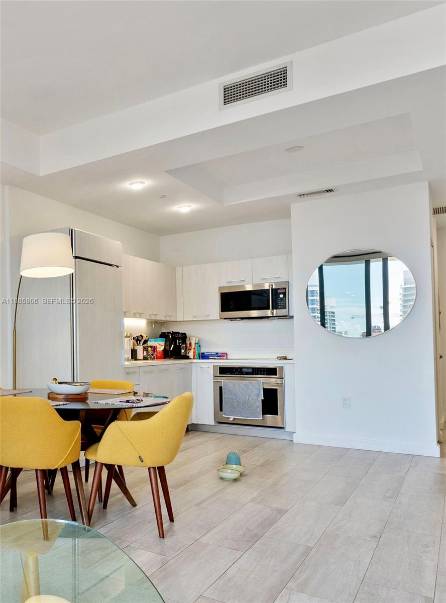 45 Southwest 9th Street, Unit 4205 Miami, FL 33130 - Photo 18 of 32 a living room with furniture and a fireplace