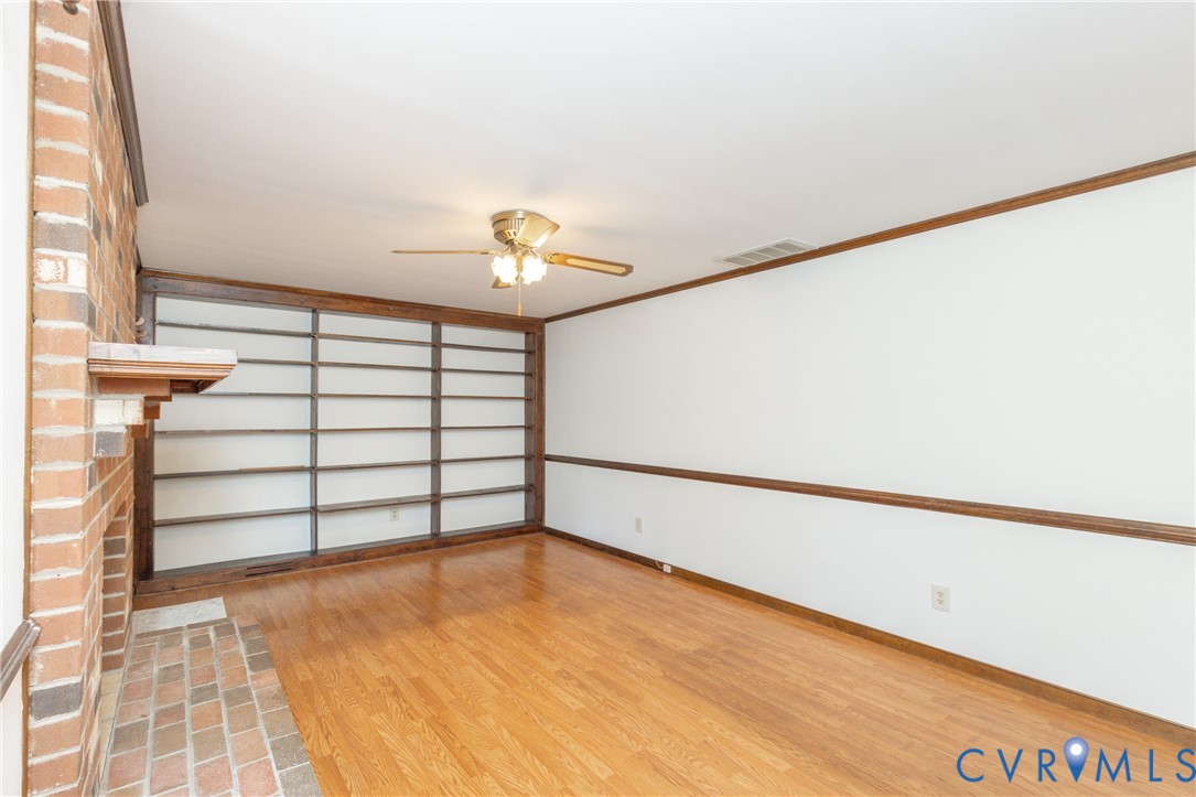 617 Rebel Ridge Road Colonial Heights, VA 23834 - Photo 21 of 49 a view of a room with stairs and a chandelier fan