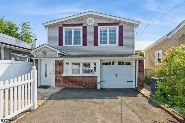 a front view of a house with a garage
