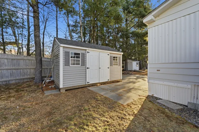 a view of backyard and garage