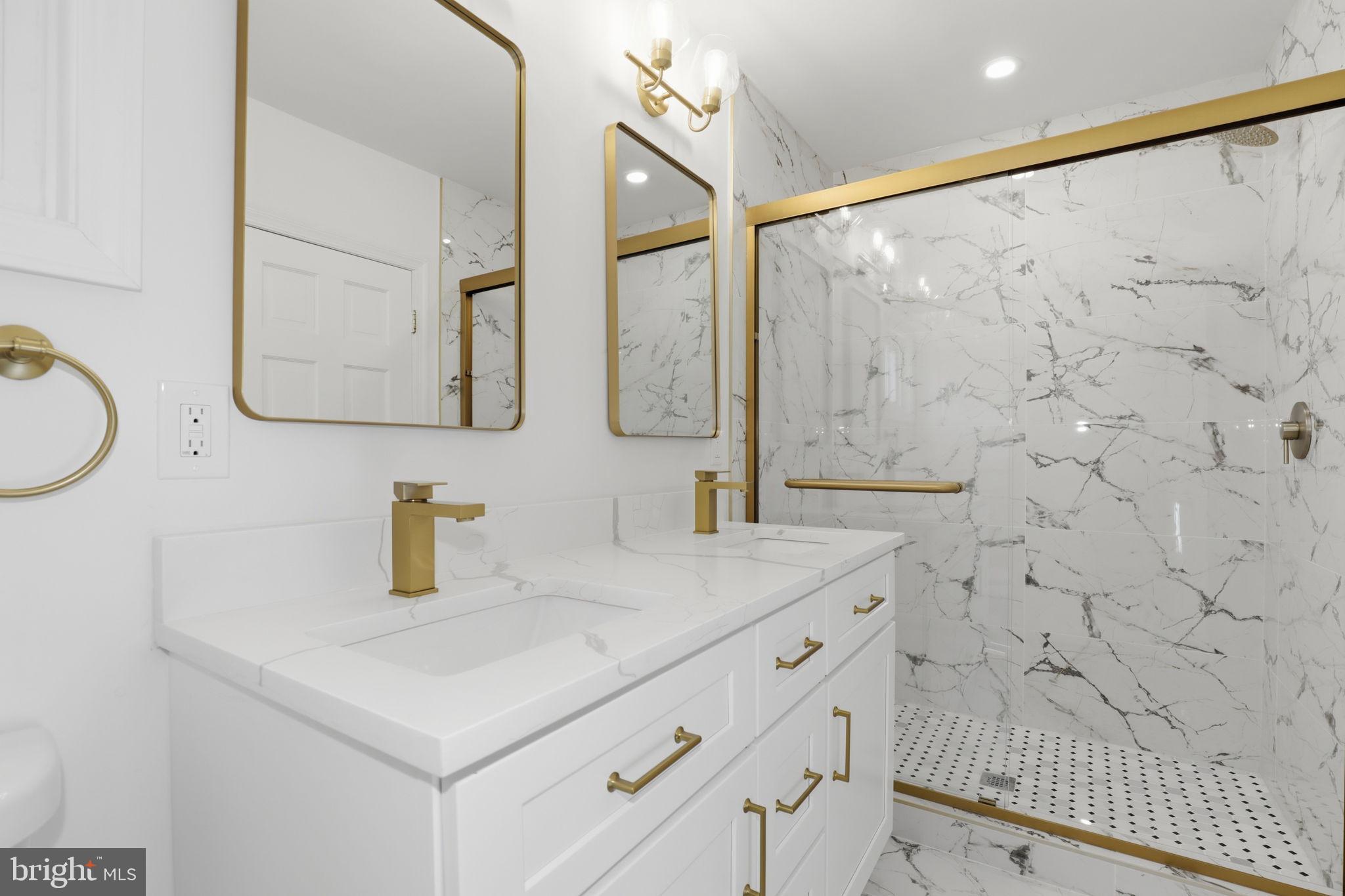 311 Ellsworth Drive Silver Spring, MD 20910 - Photo 32 of 60 a bathroom with a sink and a mirror