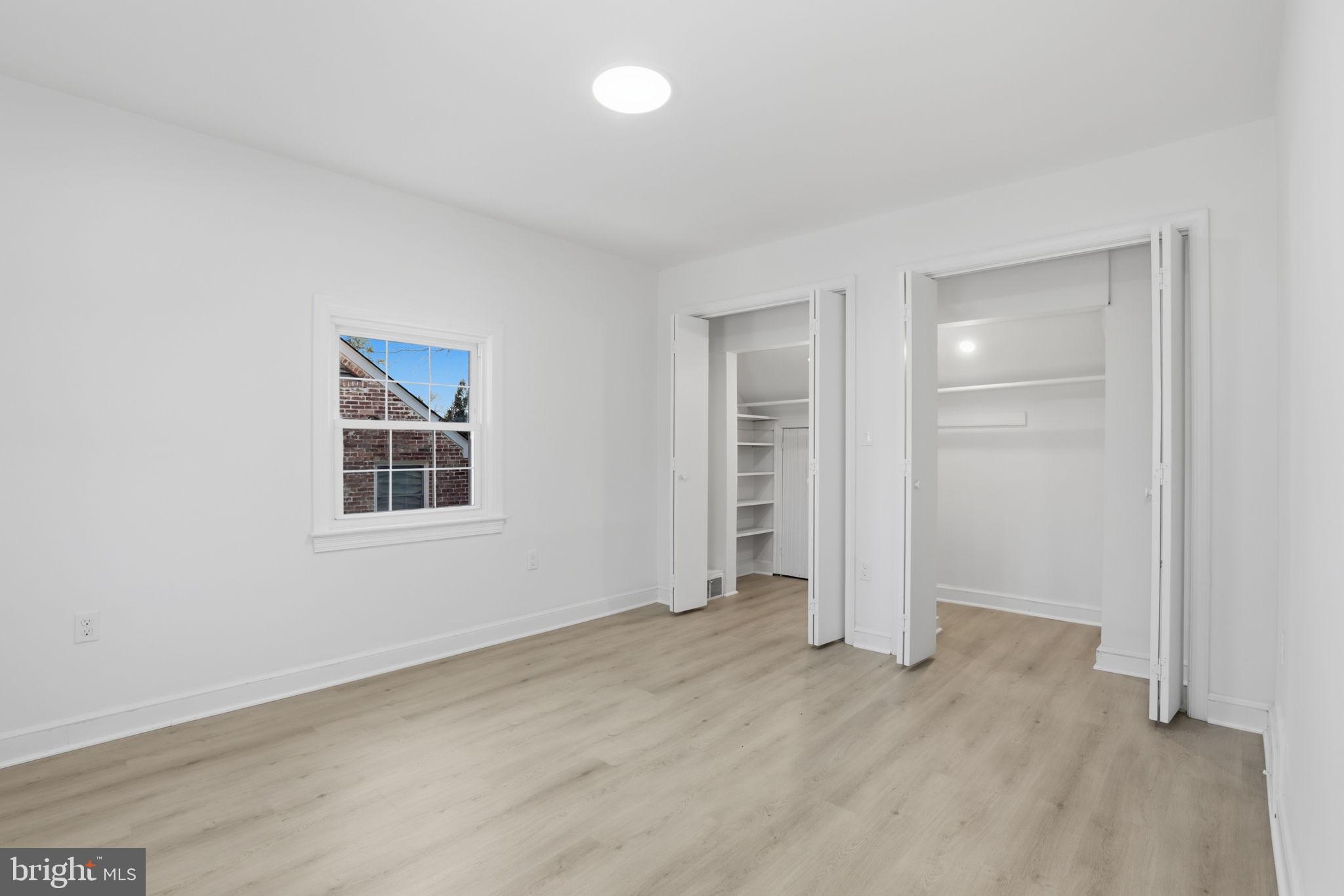 311 Ellsworth Drive Silver Spring, MD 20910 - Photo 37 of 60 an empty room with windows and closet