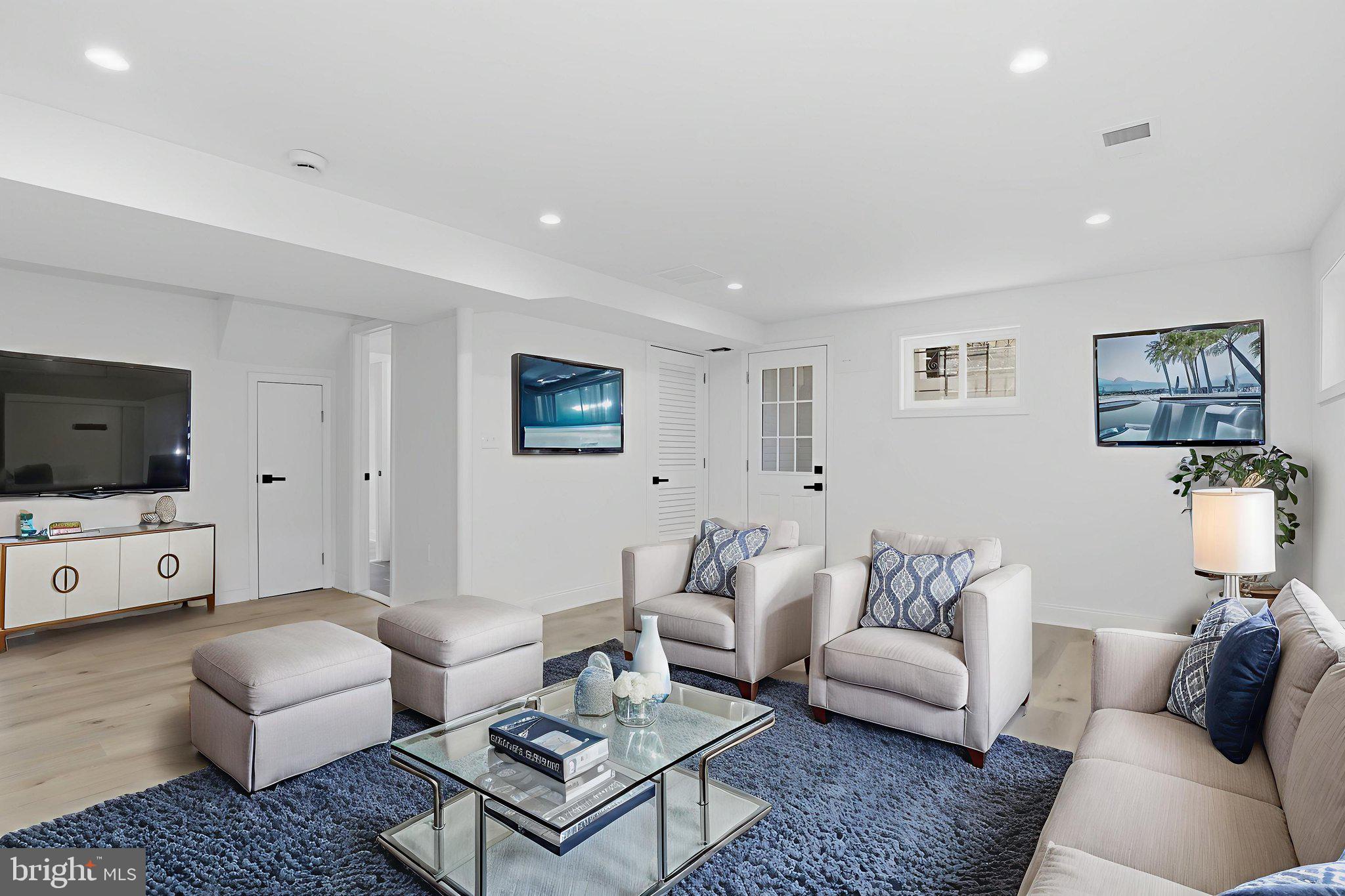 311 Ellsworth Drive Silver Spring, MD 20910 - Photo 46 of 60 a living room with furniture and a flat screen tv